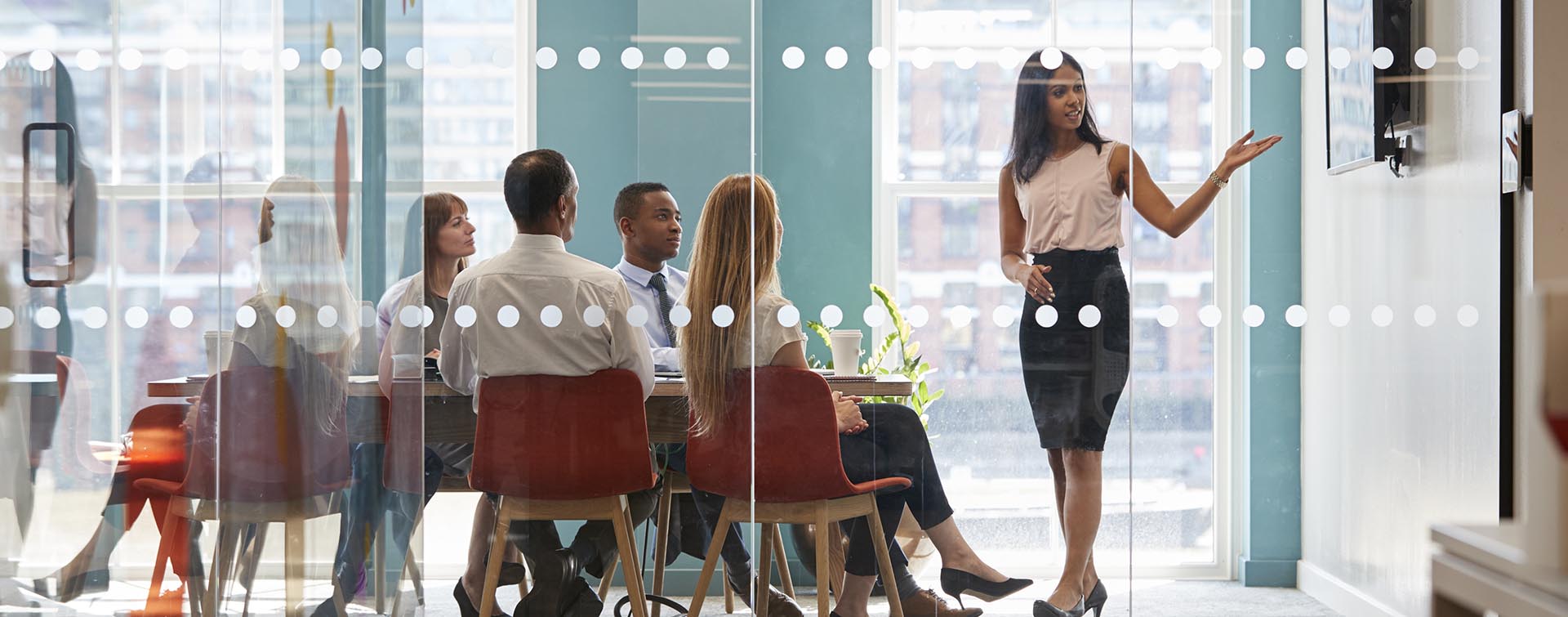 Female Presenting at a Meeting